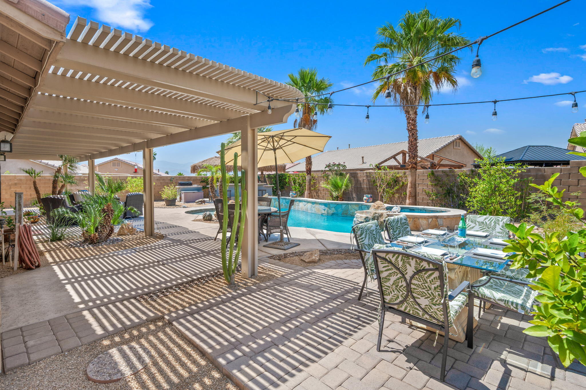 83414 Greenbrier Drive Indio, CA 92203 - Photo 35 of 43 a view of a patio with a table and chairs
