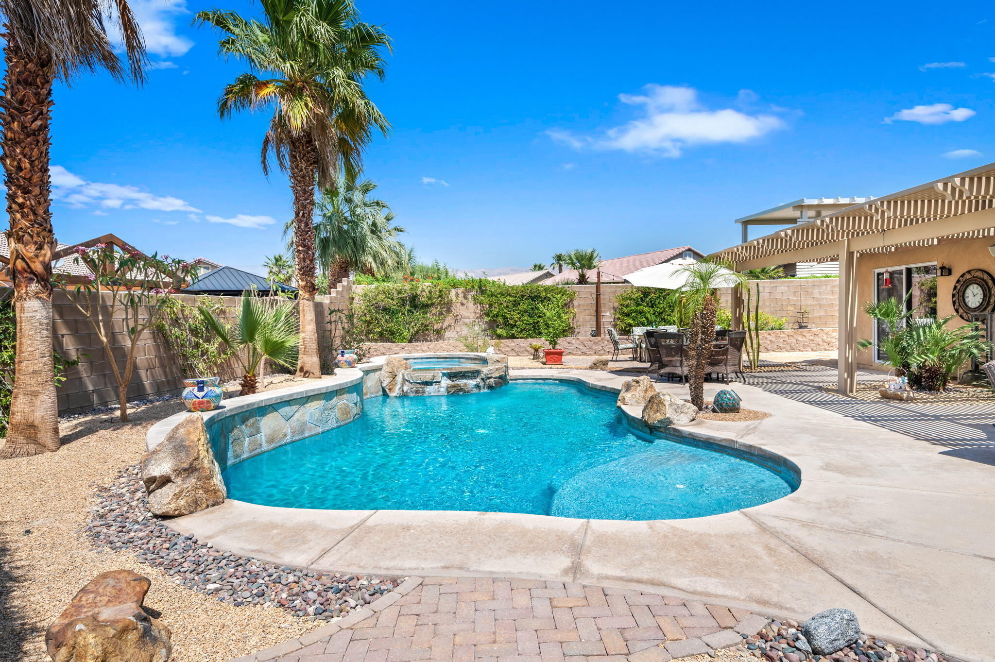 83414 Greenbrier Drive Indio, CA 92203 - Photo 38 of 43 a view of a swimming pool with a patio
