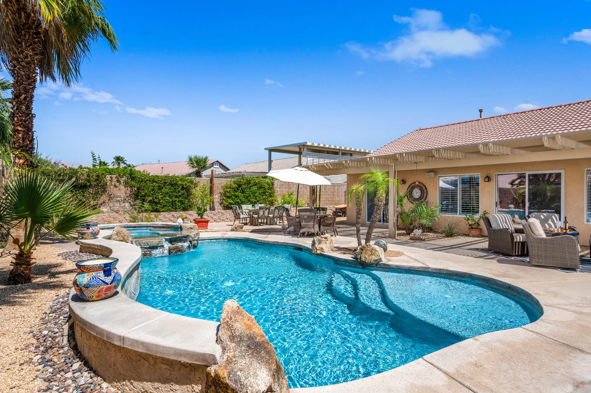 83414 Greenbrier Drive Indio, CA 92203 - Photo 39 of 43 a view of a house with swimming pool and sitting area