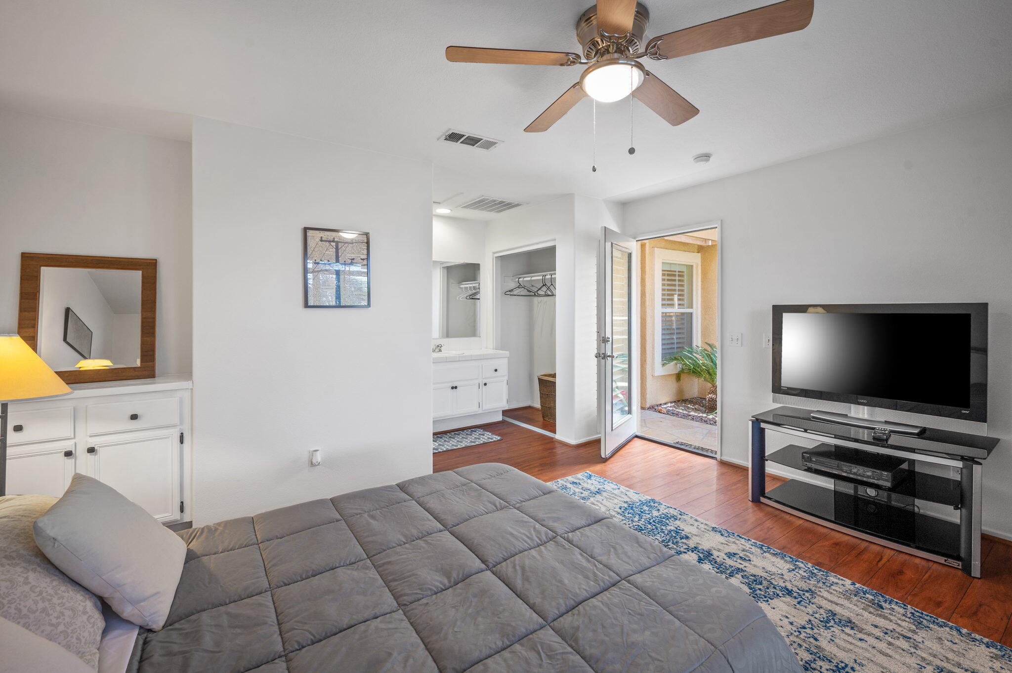 83414 Greenbrier Drive Indio, CA 92203 - Photo 42 of 43 a bedroom with a bed and a flat screen tv