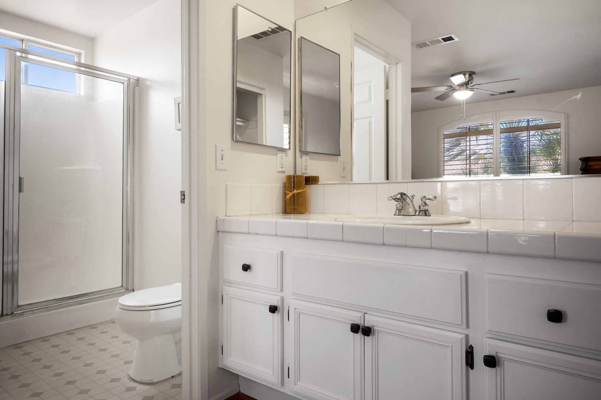 83414 Greenbrier Drive Indio, CA 92203 - Photo 43 of 43 a bathroom with a sink toilet double vanity and shower