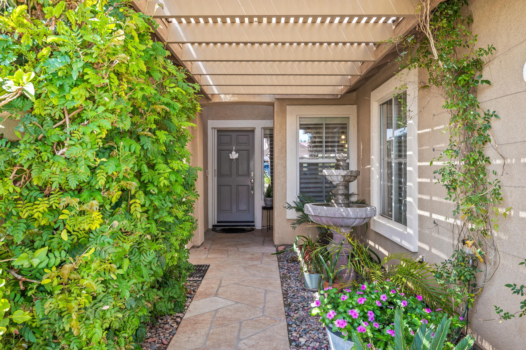 83414 Greenbrier Drive Indio, CA 92203 - Photo 8 of 43 a view of a porch with chairs and potted plants