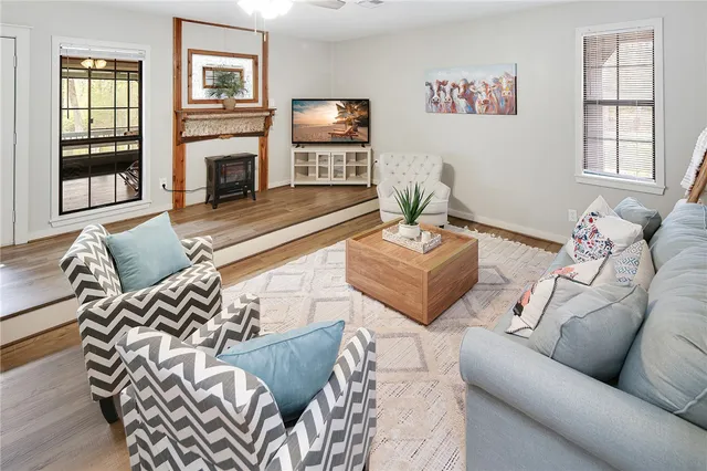 a living room with furniture and a fireplace