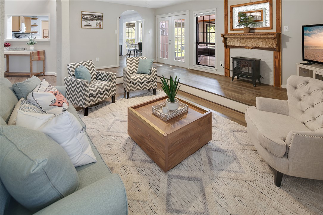 8010 Perry Lane College Station, TX 77845 - Photo 13 of 47 a living room with furniture and a fireplace