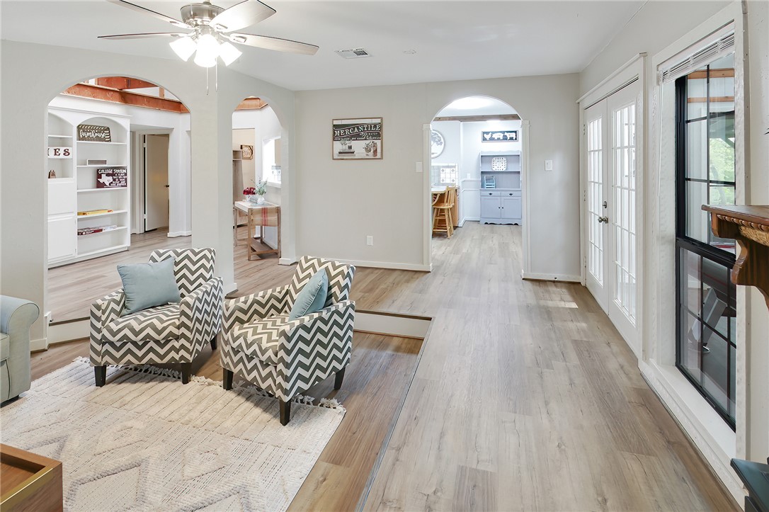 8010 Perry Lane College Station, TX 77845 - Photo 14 of 47 a living room with furniture and a chandelier