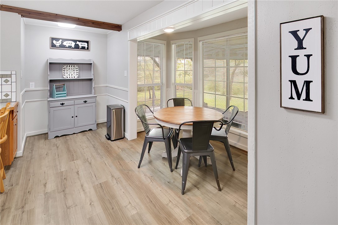 8010 Perry Lane College Station, TX 77845 - Photo 15 of 47 a view of a dining room with furniture window and wooden floor