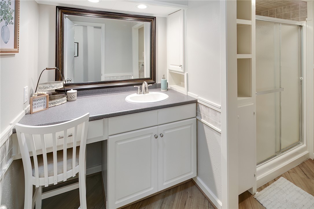 8010 Perry Lane College Station, TX 77845 - Photo 26 of 47 a bathroom with a double vanity sink and a mirror