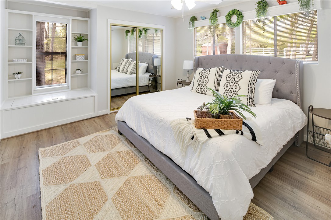 8010 Perry Lane College Station, TX 77845 - Photo 27 of 47 a bed sitting in a bedroom next to a window