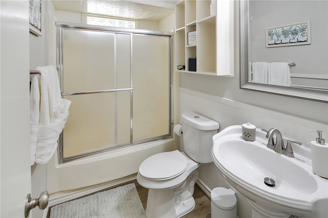 8010 Perry Lane College Station, TX 77845 - Photo 28 of 47 a white toilet sitting next to a bathroom sink