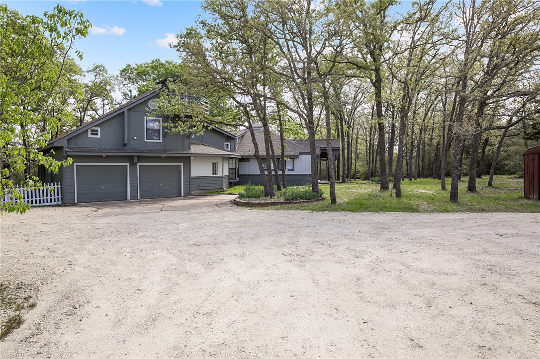 8010 Perry Lane College Station, TX 77845 - Photo 3 of 47 a front view of a house with garden