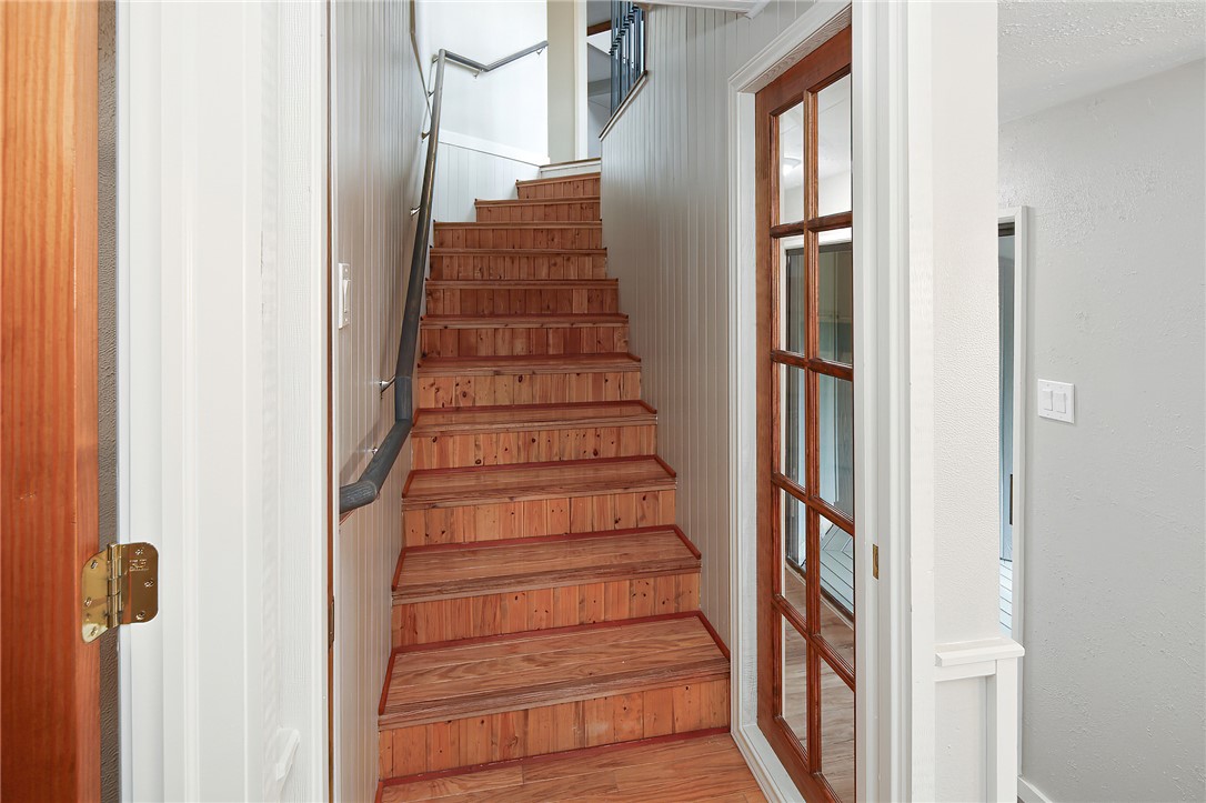 8010 Perry Lane College Station, TX 77845 - Photo 32 of 47 a view of entryway and gallery with wooden floor