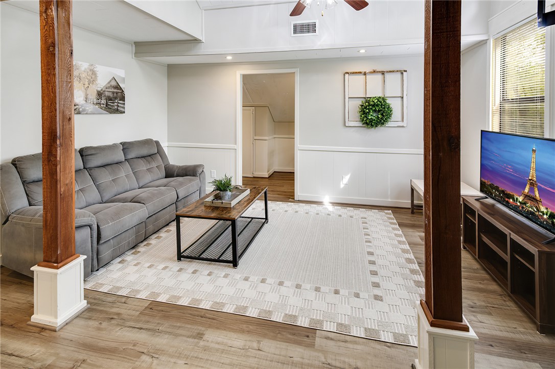 8010 Perry Lane College Station, TX 77845 - Photo 35 of 47 a living room with furniture and a flat screen tv