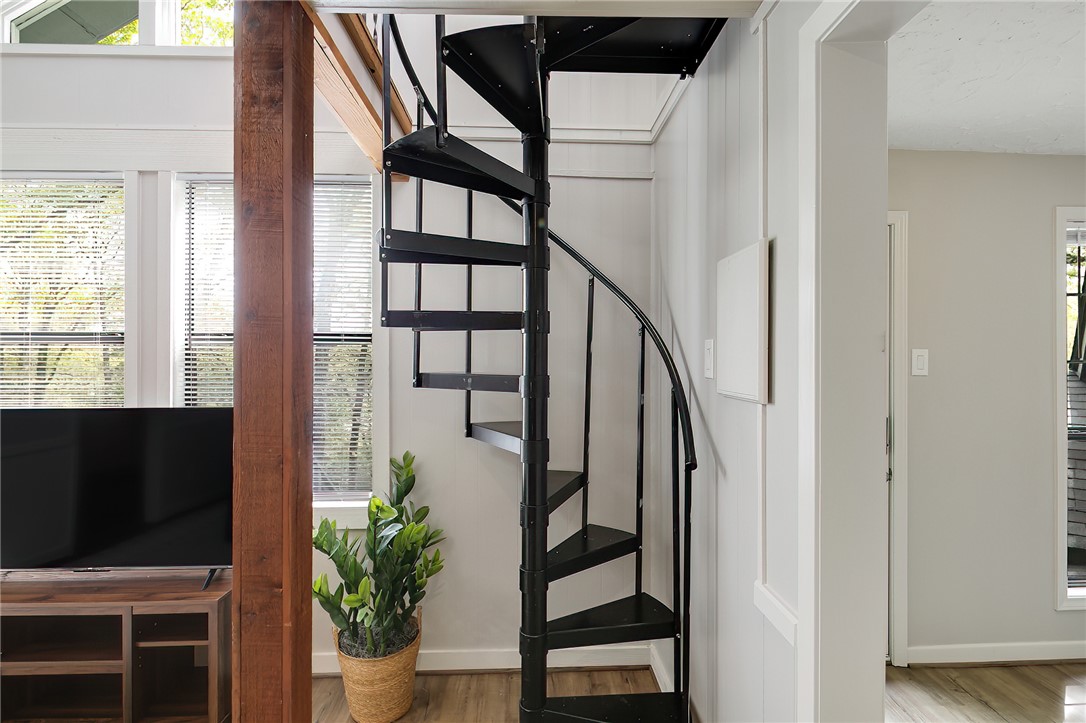 8010 Perry Lane College Station, TX 77845 - Photo 41 of 47 a view of staircase with wooden floor and a potted plant