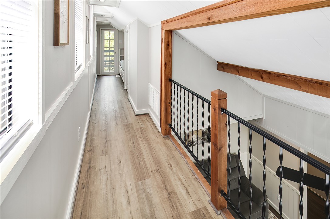 8010 Perry Lane College Station, TX 77845 - Photo 42 of 47 a view of a hallway with wooden floor and staircase
