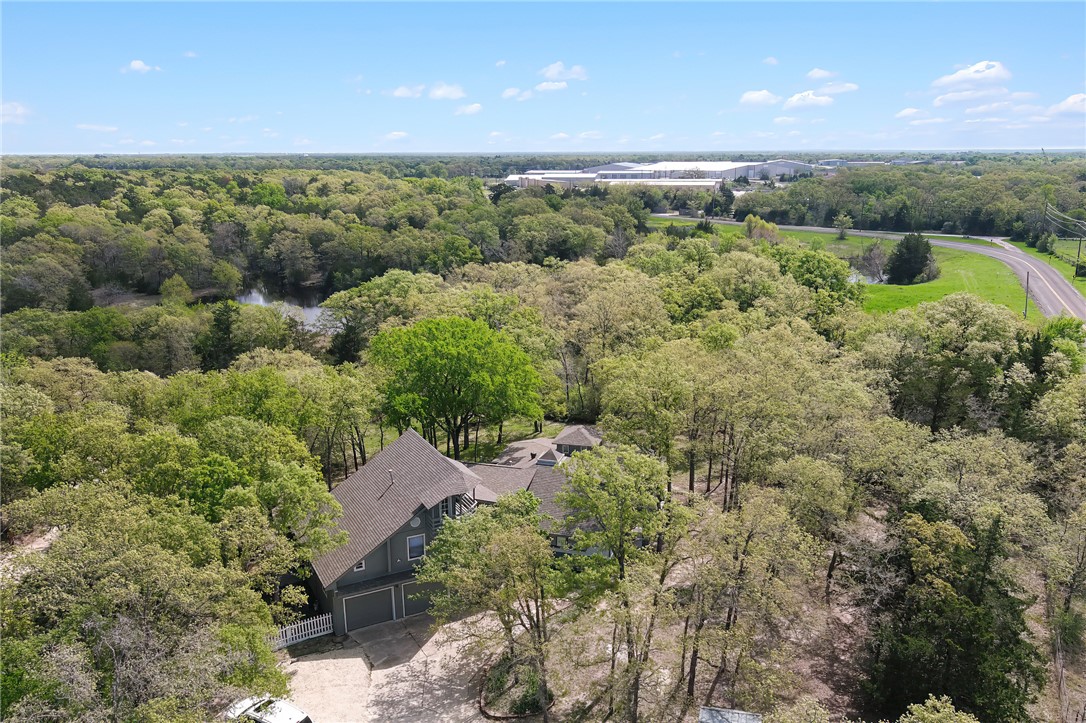 8010 Perry Lane College Station, TX 77845 - Photo 45 of 47 a view of a forest with a street