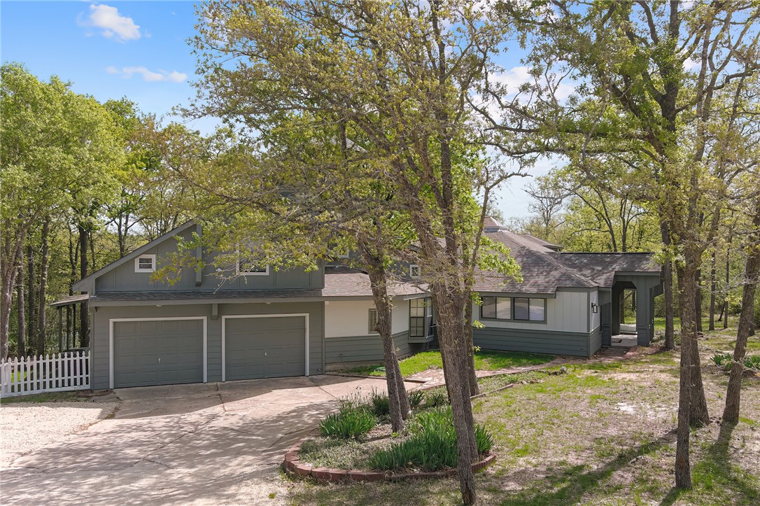 8010 Perry Lane College Station, TX 77845 - Photo 5 of 47 a front view of a house with garden