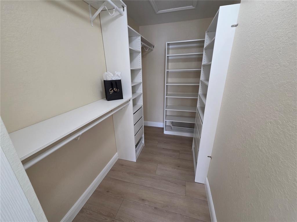 8905 Manor Loop, Unit 205 Lakewood Ranch, FL 34202 - Photo 23 of 30 a view of walk in closet with empty racks