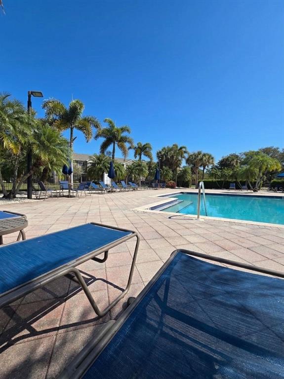 8905 Manor Loop, Unit 205 Lakewood Ranch, FL 34202 - Photo 30 of 30 a view of an outdoor space and tv