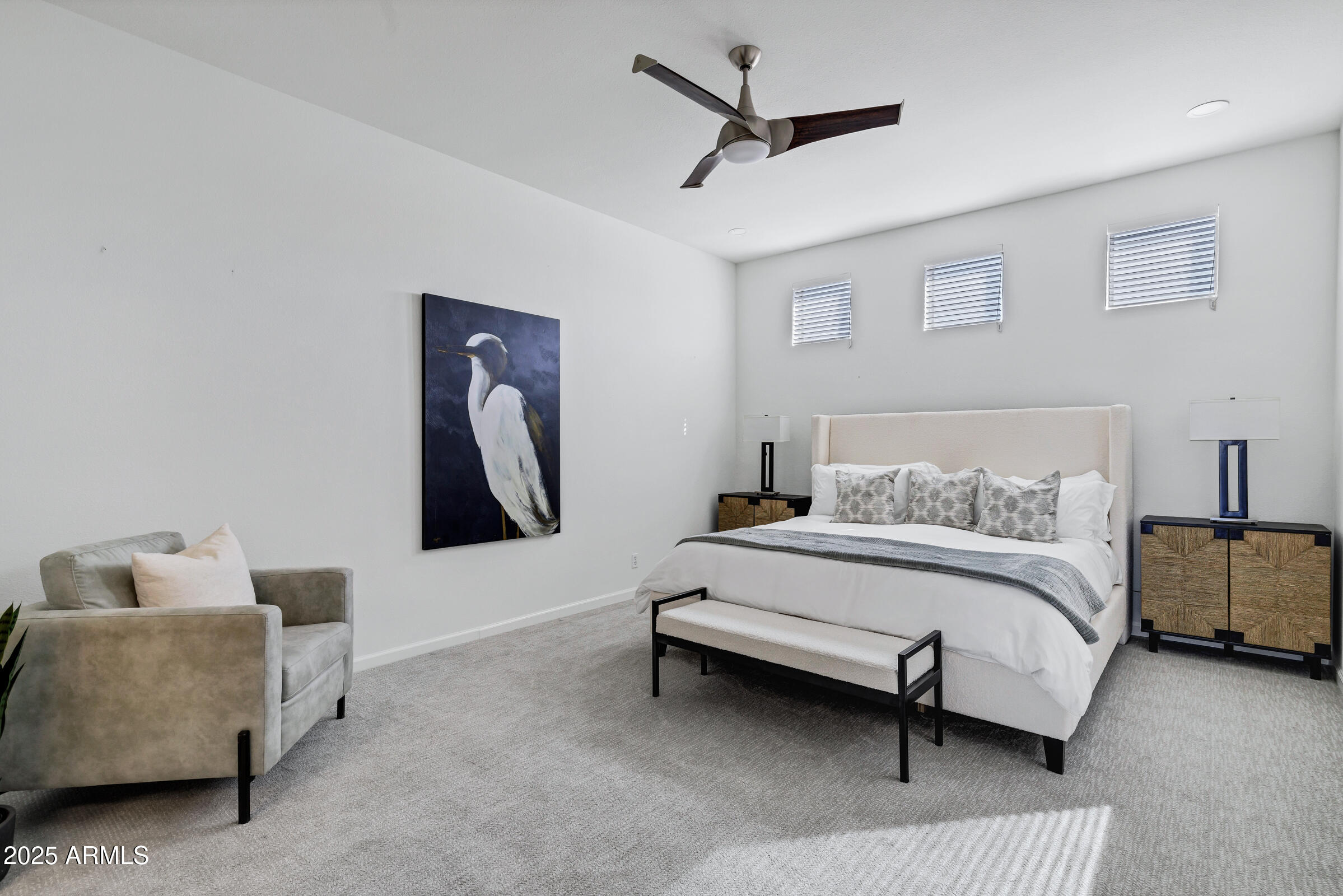 8270 North Hayden Road, Unit 2010 Scottsdale, AZ 85258 - Photo 18 of 54 a spacious bedroom with a bed and a couch