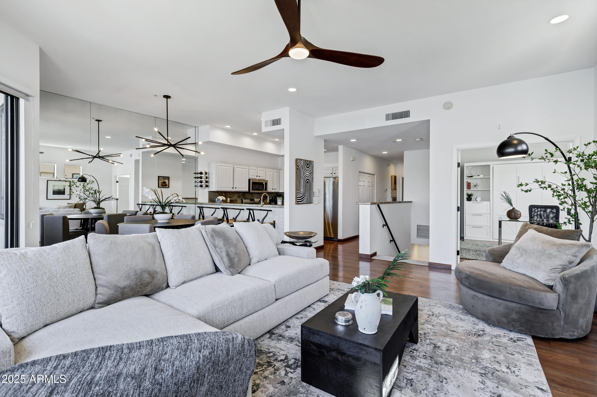 8270 North Hayden Road, Unit 2010 Scottsdale, AZ 85258 - Photo 3 of 54 a living room with furniture kitchen view and a chandelier