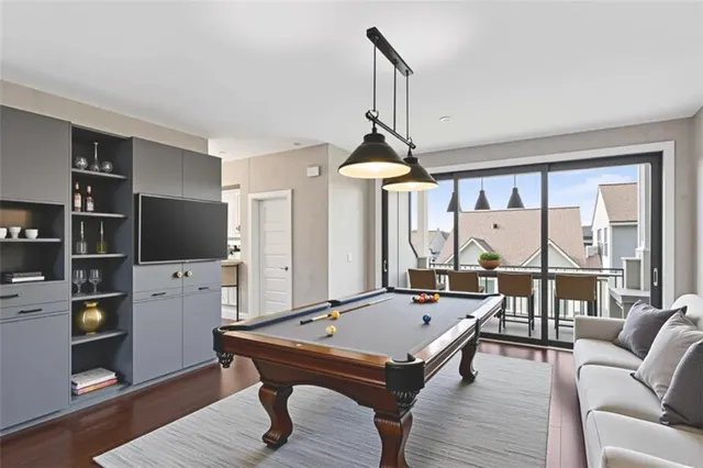 a living room with furniture a table and a large window