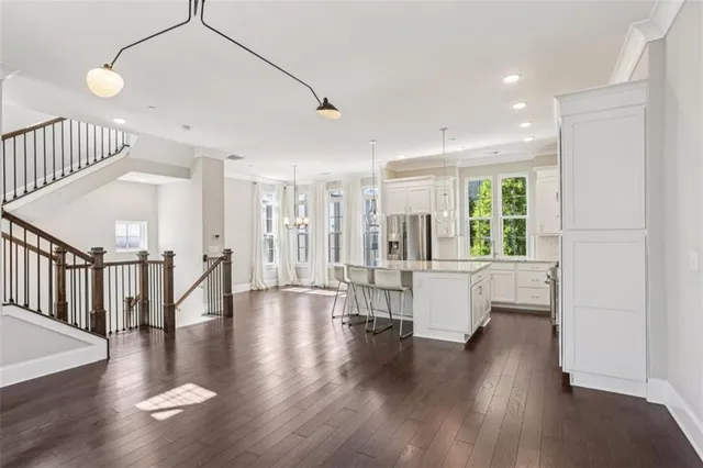 a view of an entryway with wooden floor and windows
