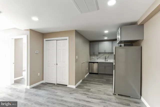 a view of a kitchen with a refrigerator and a stove