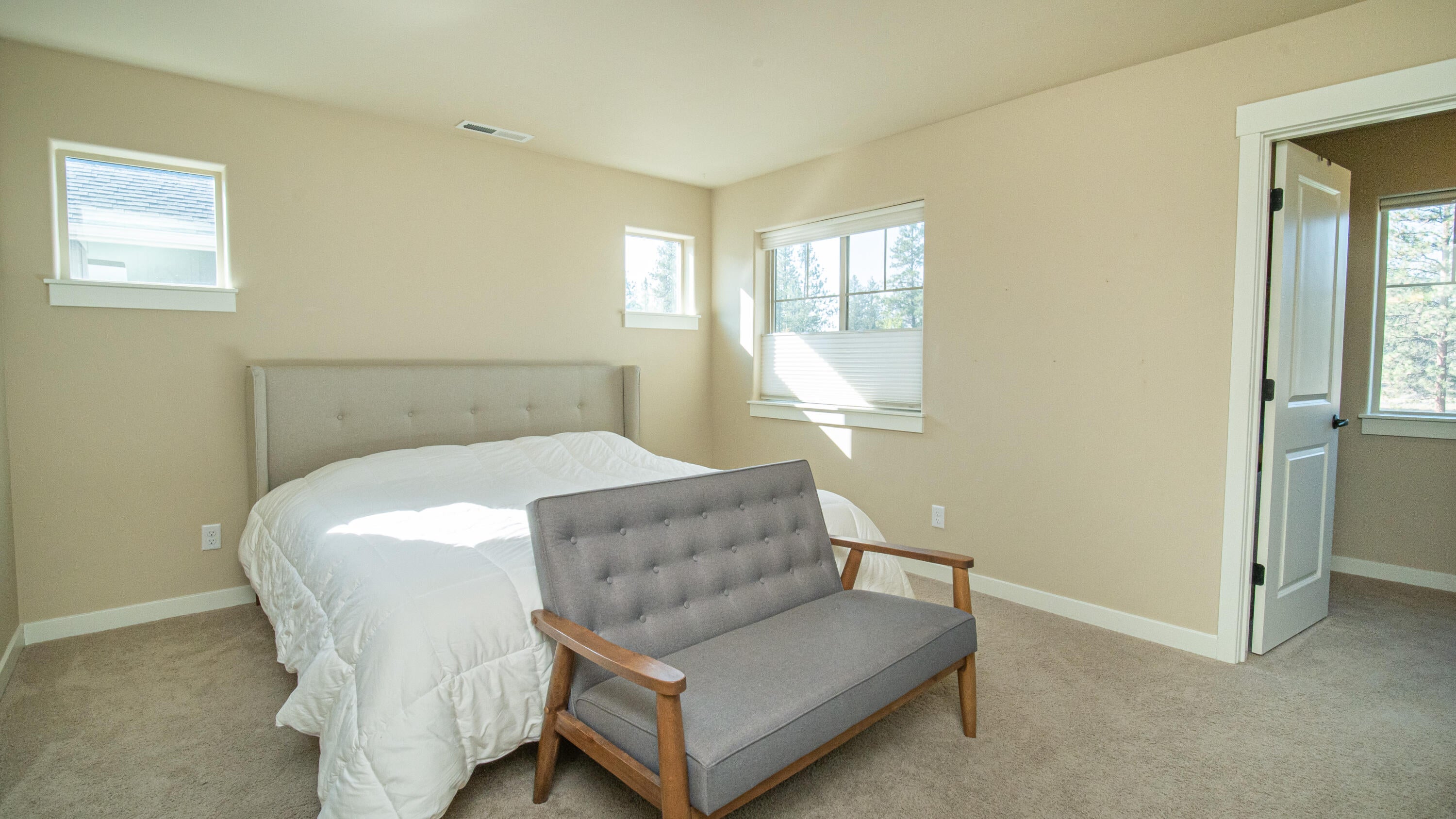 20896 Sotra Loop Bend, OR 97702 - Photo 8 of 21 Master bedroom with spacious walk-in closet and bath ensuite