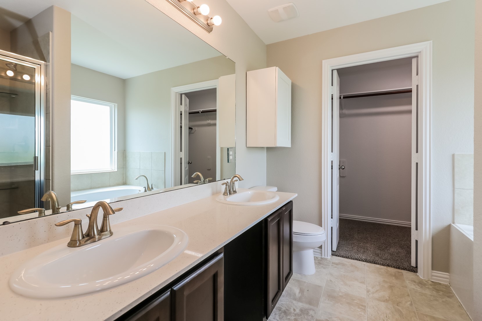 2706 Old Draw Drive Humble, TX 77396 - Photo 13 of 15 a bathroom with a sink double vanity and a mirror