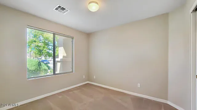 an empty room with windows and view