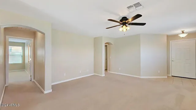 a view of a livingroom with a ceiling fan