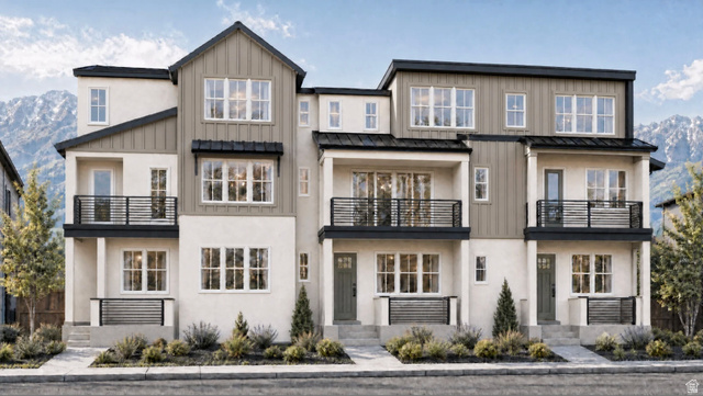 876 West 850 South, Unit 103B Springville, UT 84663 - Photo 1 of 1 Modern townhome-style residences featuring multi-level facades with balconies, board and batten accents, and contemporary railing details