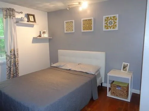 a bedroom with a bed and a table