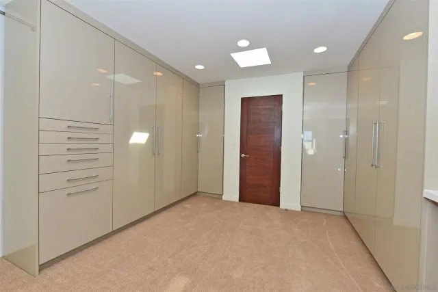 an empty room with closet area