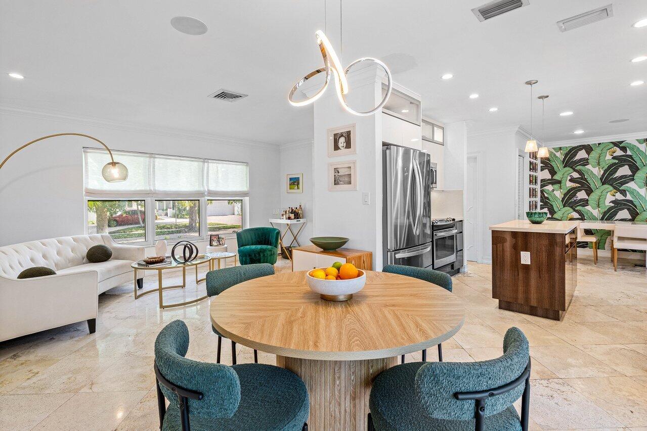 1181 Walnut Terrace Boca Raton, FL 33486 - Photo 12 of 26 a living room with furniture and a chandelier