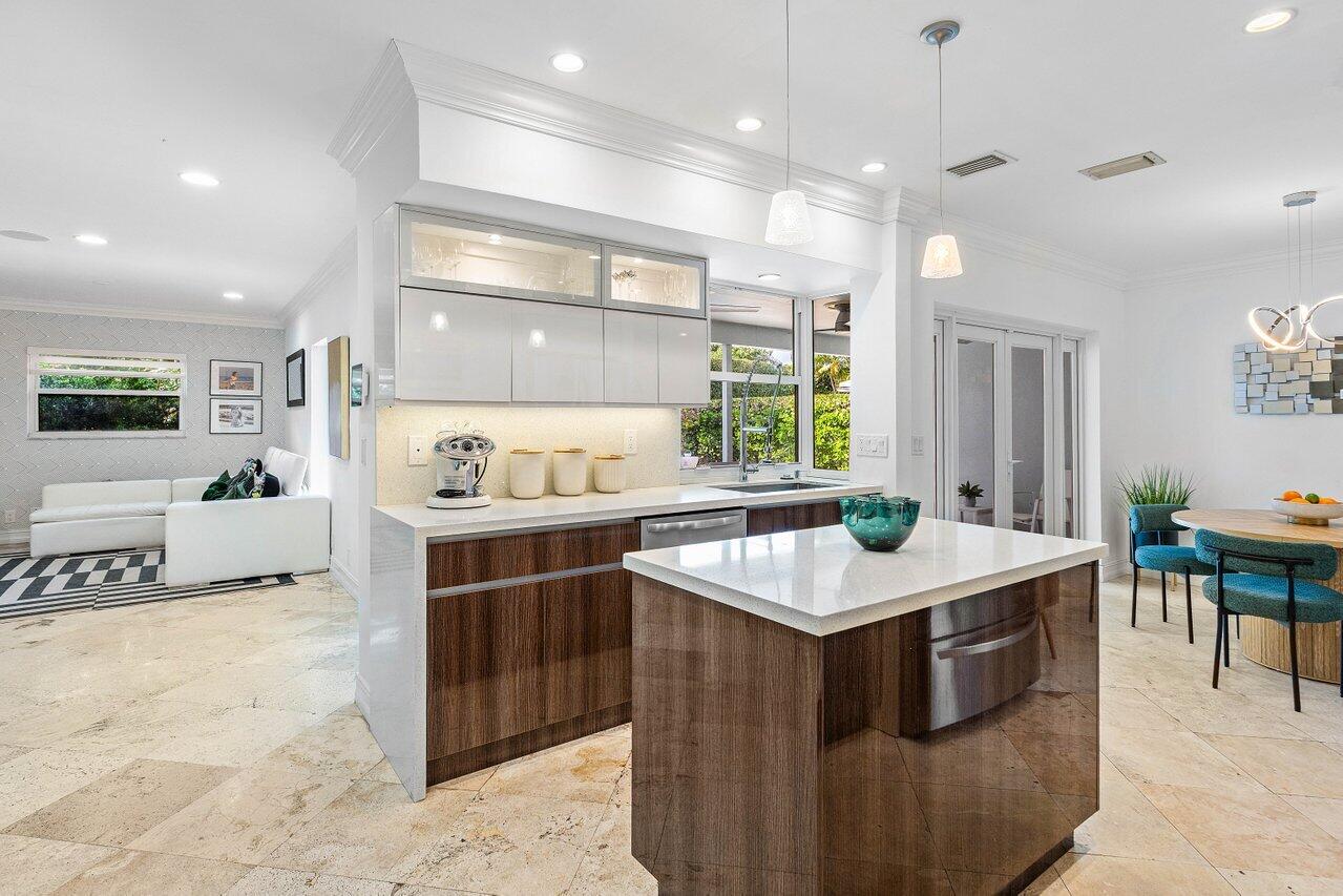 1181 Walnut Terrace Boca Raton, FL 33486 - Photo 13 of 26 a kitchen with a stove a sink a refrigerator and chairs