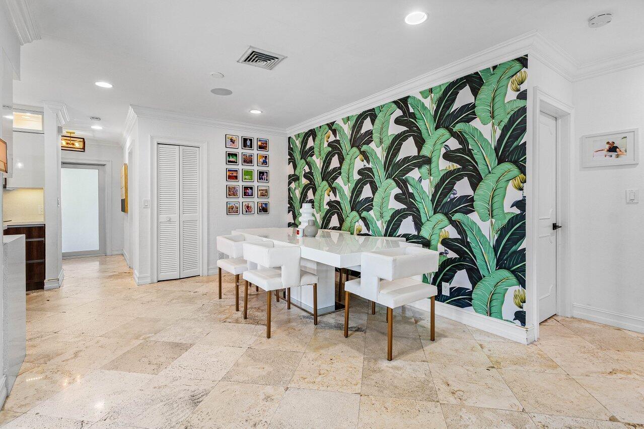 1181 Walnut Terrace Boca Raton, FL 33486 - Photo 16 of 26 a view of a dining room with furniture and a potted plant