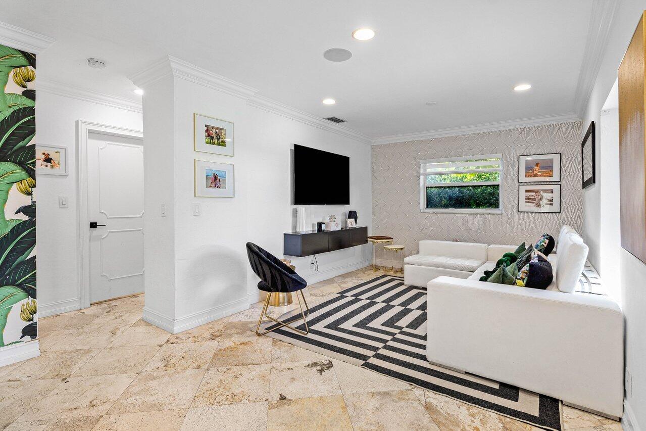 1181 Walnut Terrace Boca Raton, FL 33486 - Photo 17 of 26 a living room with furniture and a flat screen tv