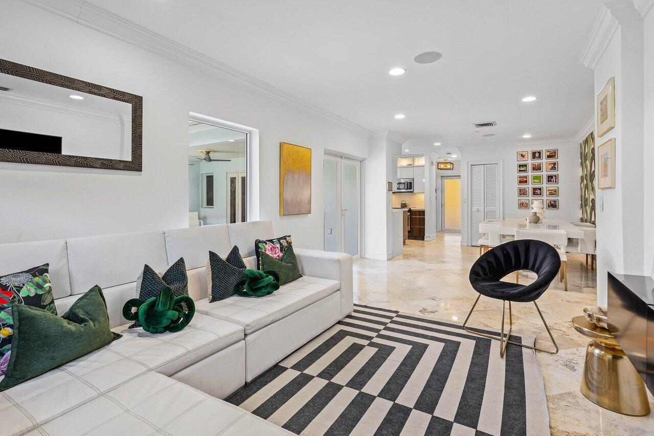1181 Walnut Terrace Boca Raton, FL 33486 - Photo 18 of 26 a living room with furniture and a chandelier