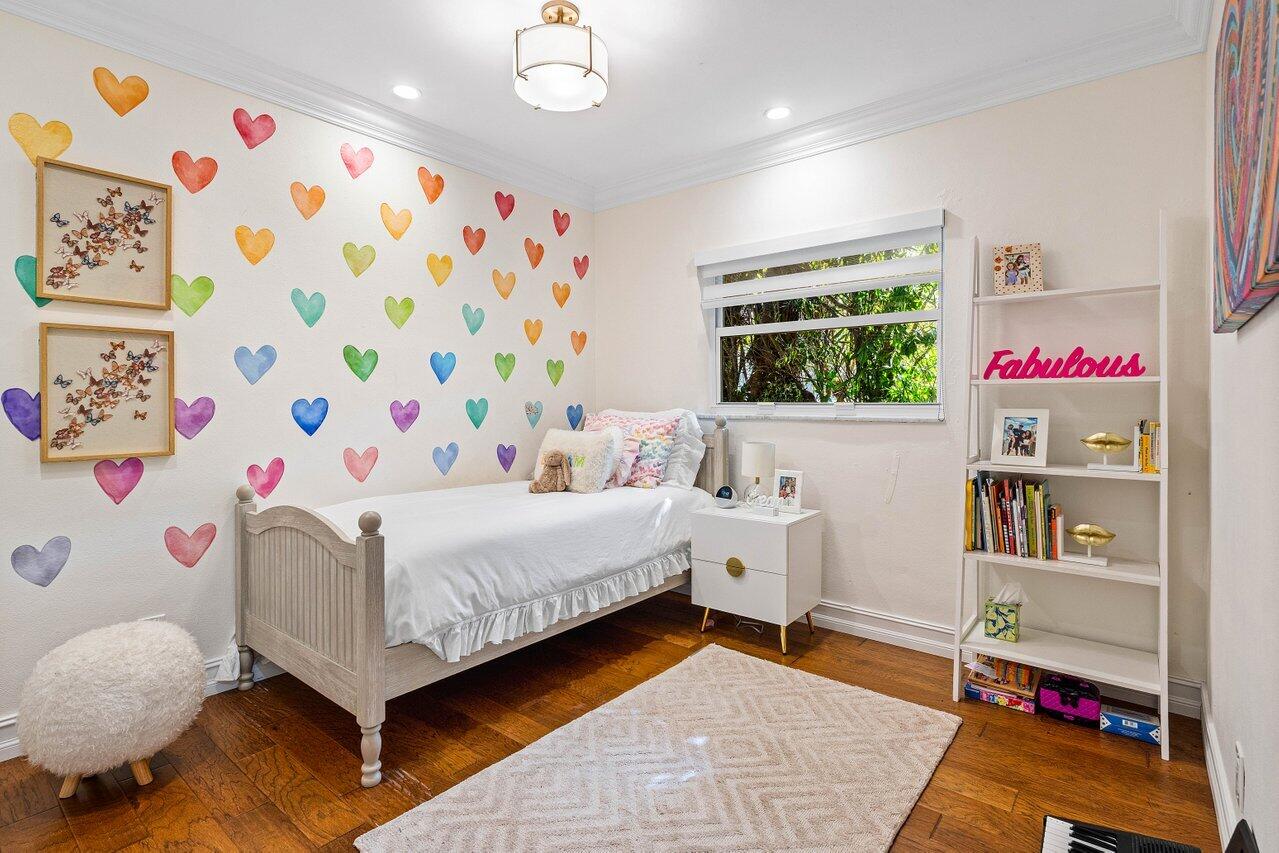 1181 Walnut Terrace Boca Raton, FL 33486 - Photo 19 of 26 a bedroom with furniture and a book shelf