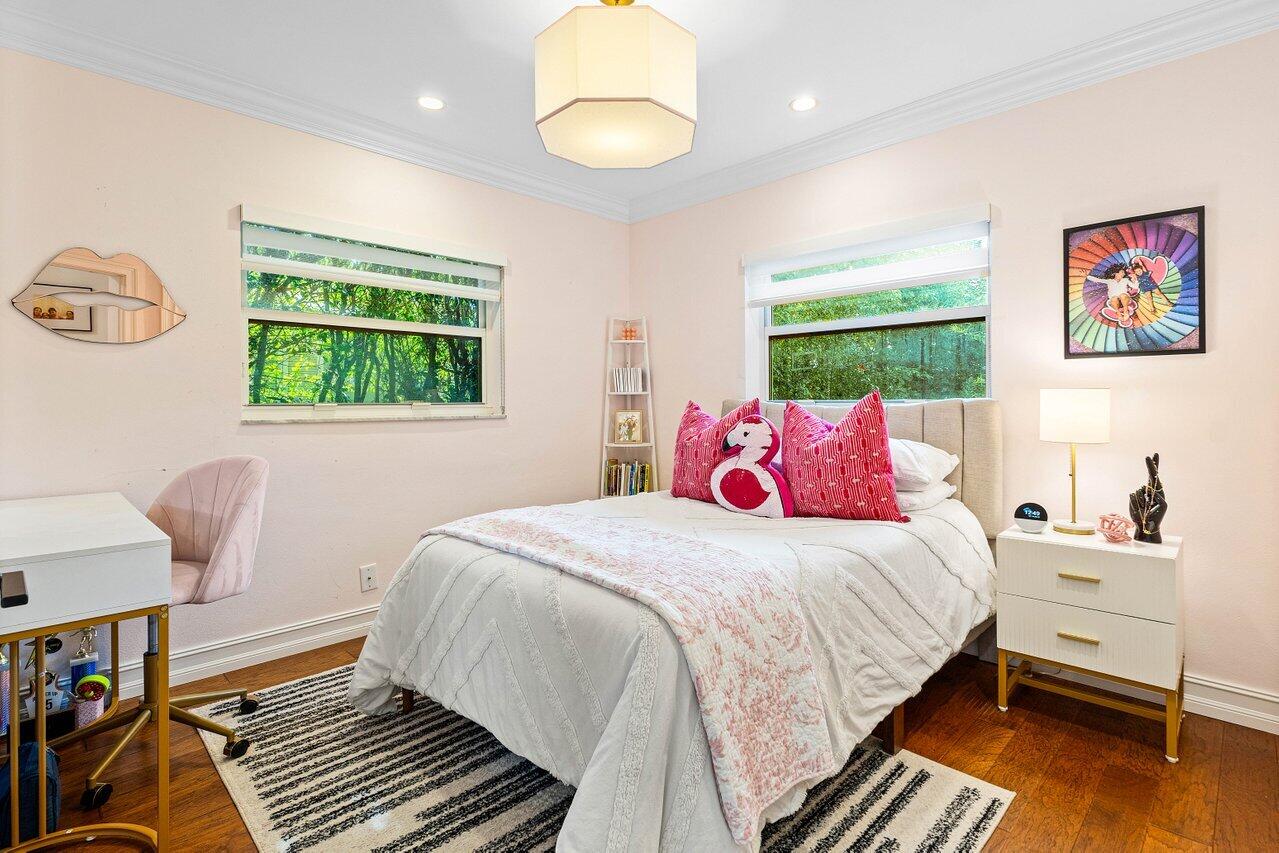 1181 Walnut Terrace Boca Raton, FL 33486 - Photo 21 of 26 a bedroom with a bed and a window