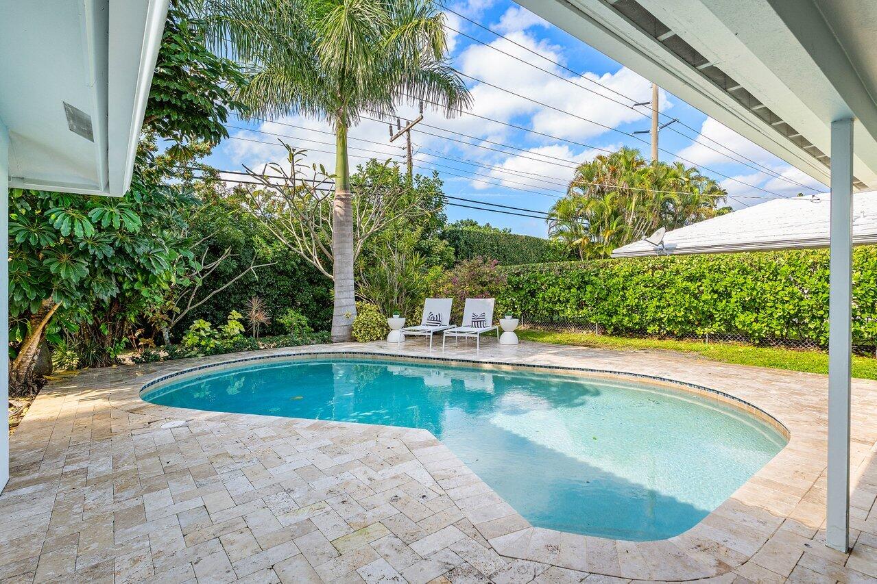 1181 Walnut Terrace Boca Raton, FL 33486 - Photo 23 of 26 a view of a swimming pool with a yard