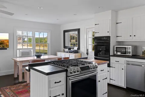 a kitchen with a stove and a sink