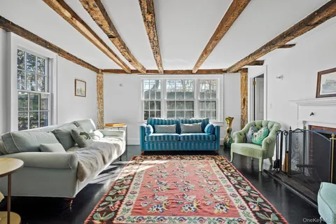 a living room with furniture and a rug