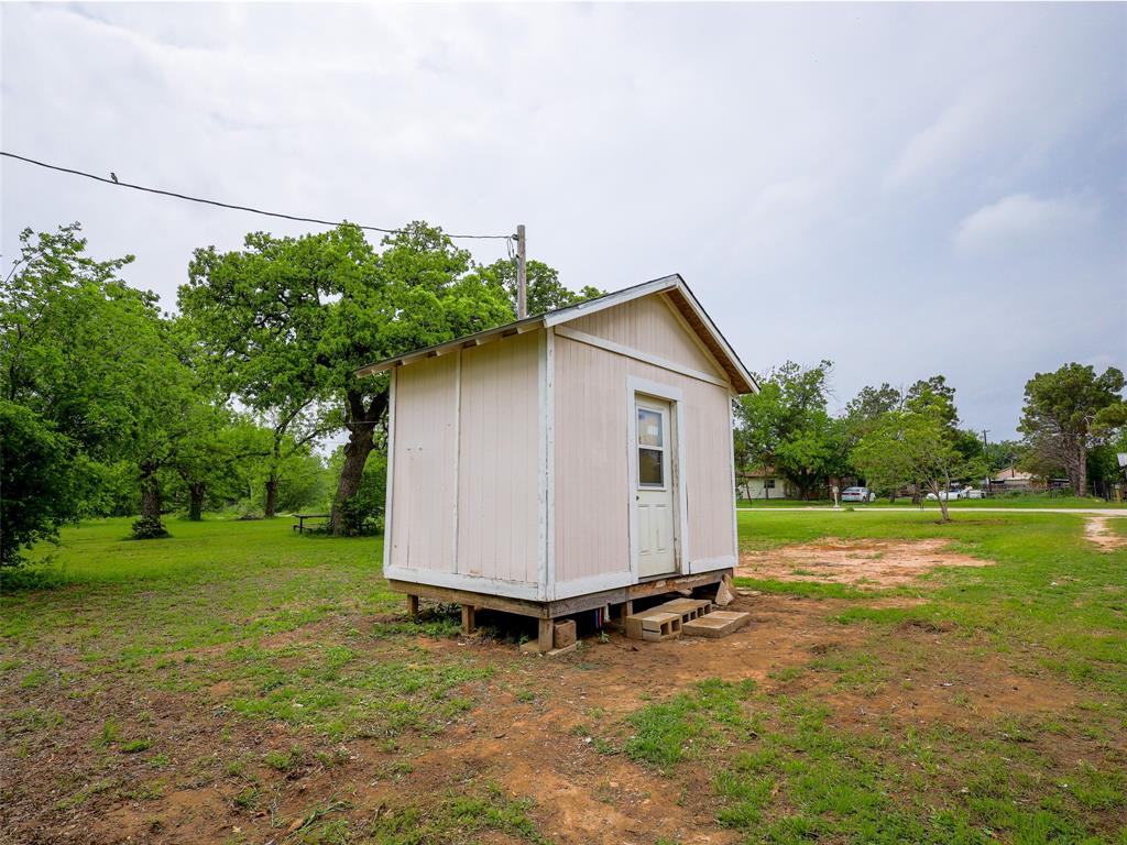 609 West 12th Street Cisco, TX 76437 - Photo 6 of 11 a view of backyard with small cabin