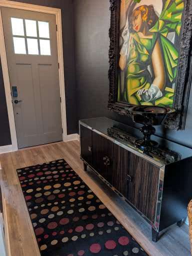 336 Kitty Hawk Road Georgetown, TX 78633 - Photo 5 of 40 Richly toned walls and warm wood flooring frame a welcoming entry hall.