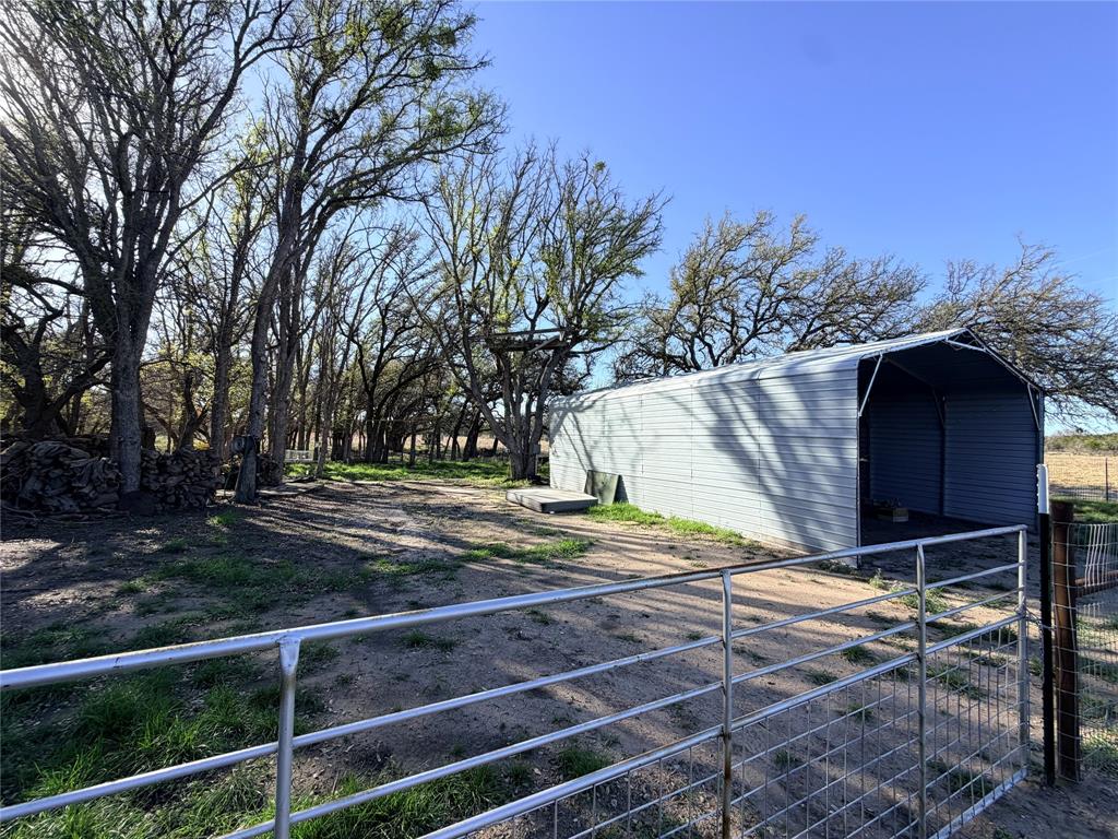360 State Highway South Goldthwaite, TX 76844 - Photo 17 of 40 a view of a barn with wooden fence