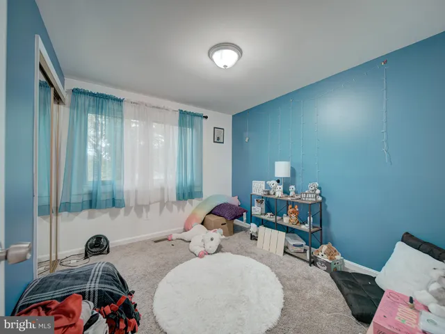 a bedroom with furniture and a chandelier