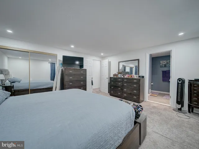 a bathroom with a sink a vanity and a shower