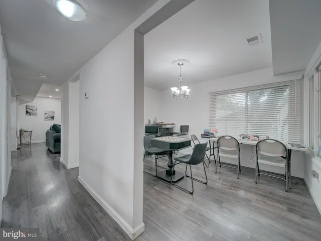a view of a livingroom with furniture and hardwood floor
